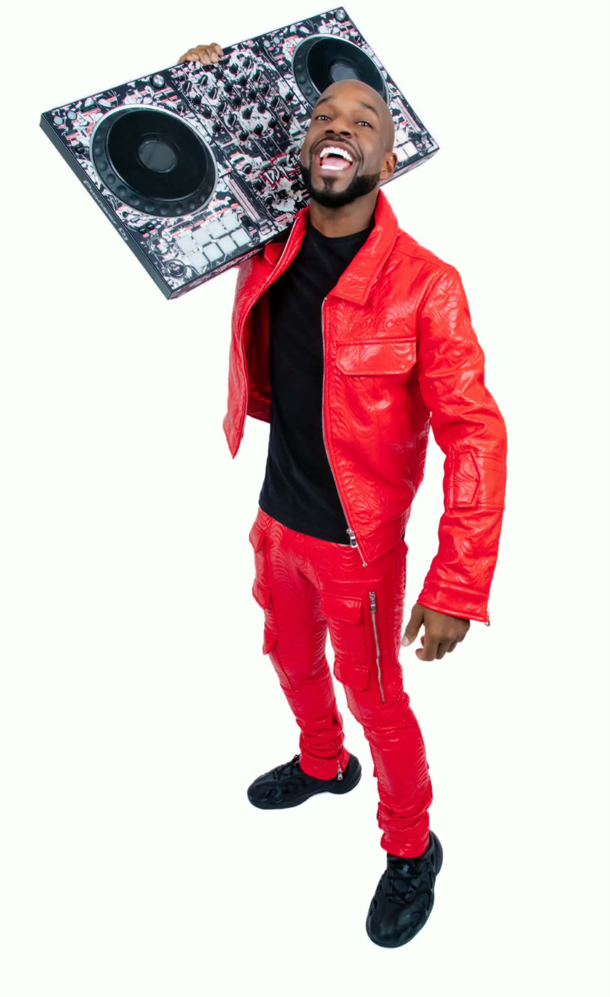 DJ KCeaser promotional DJ portrait with controller