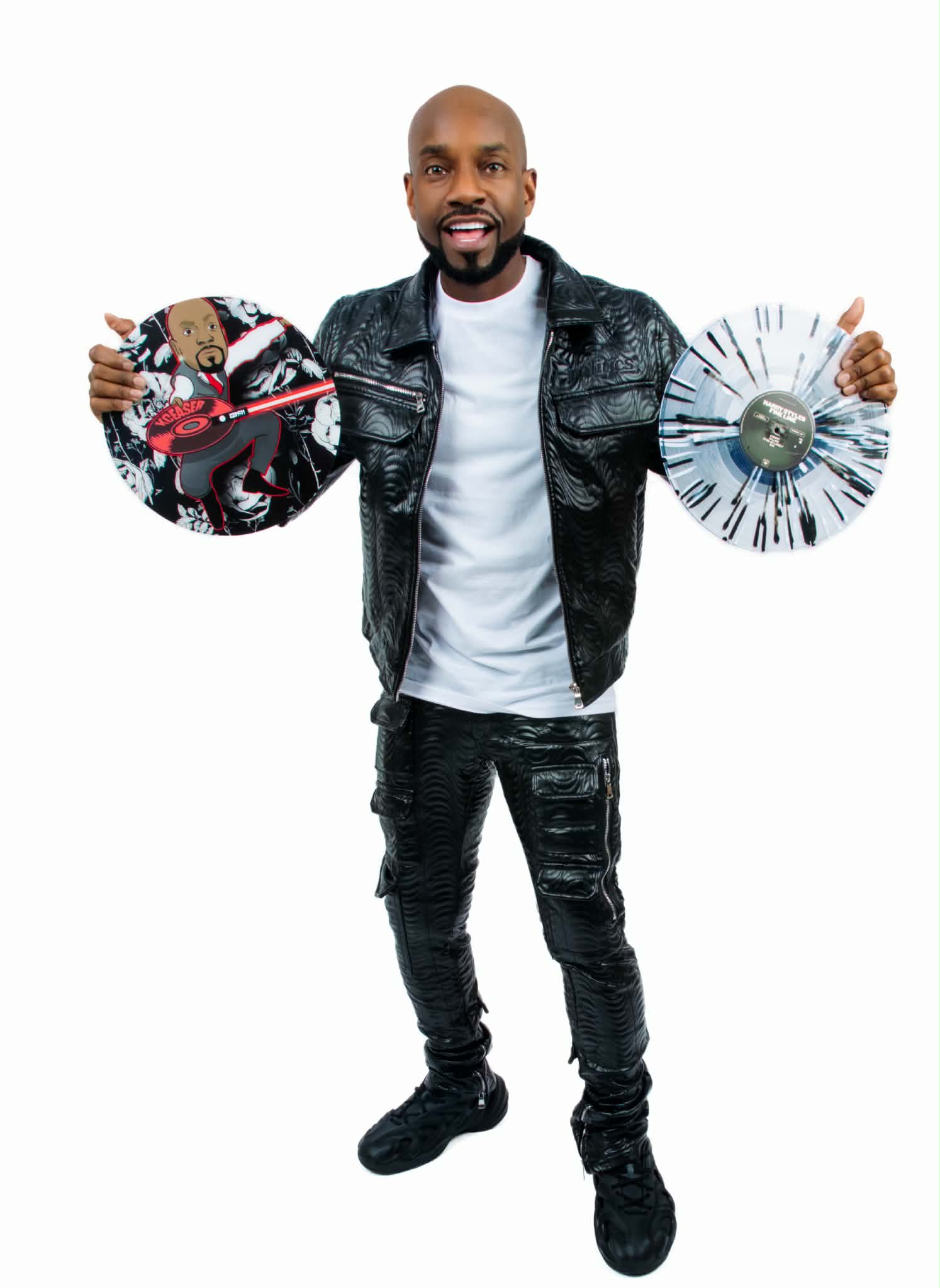 DJ KCeaser holding vinyl records
